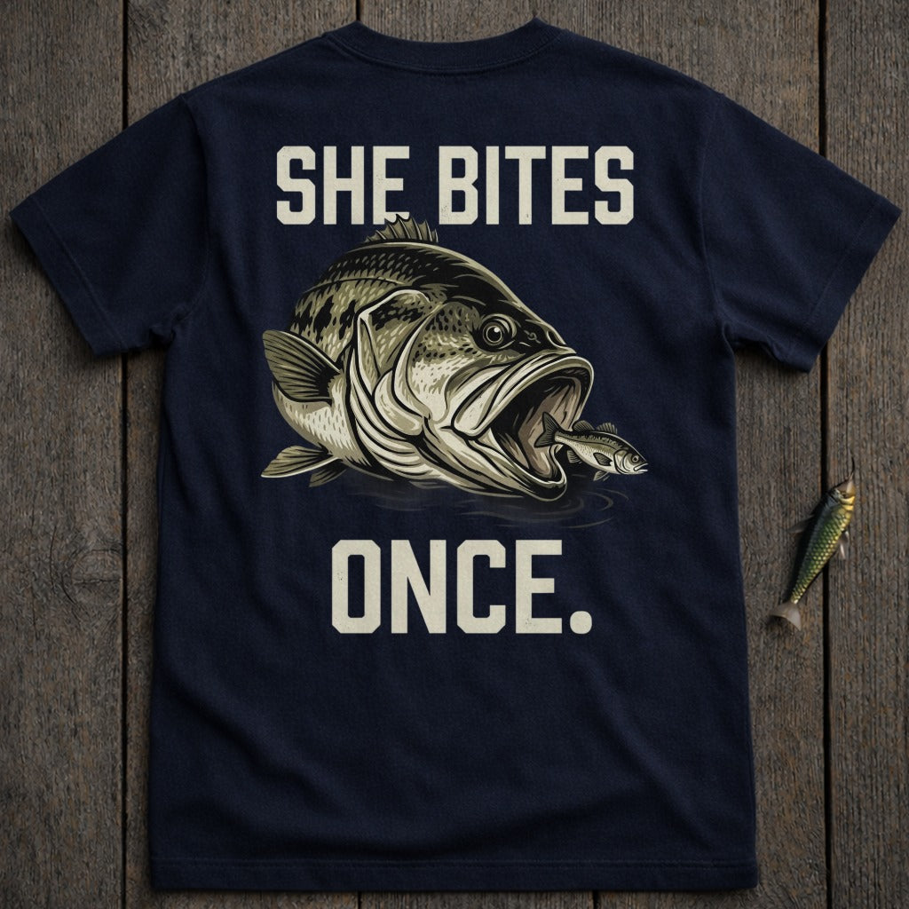 Navy t-shirt with a large bass eating a smaller fish and text "SHE BITES ONCE."