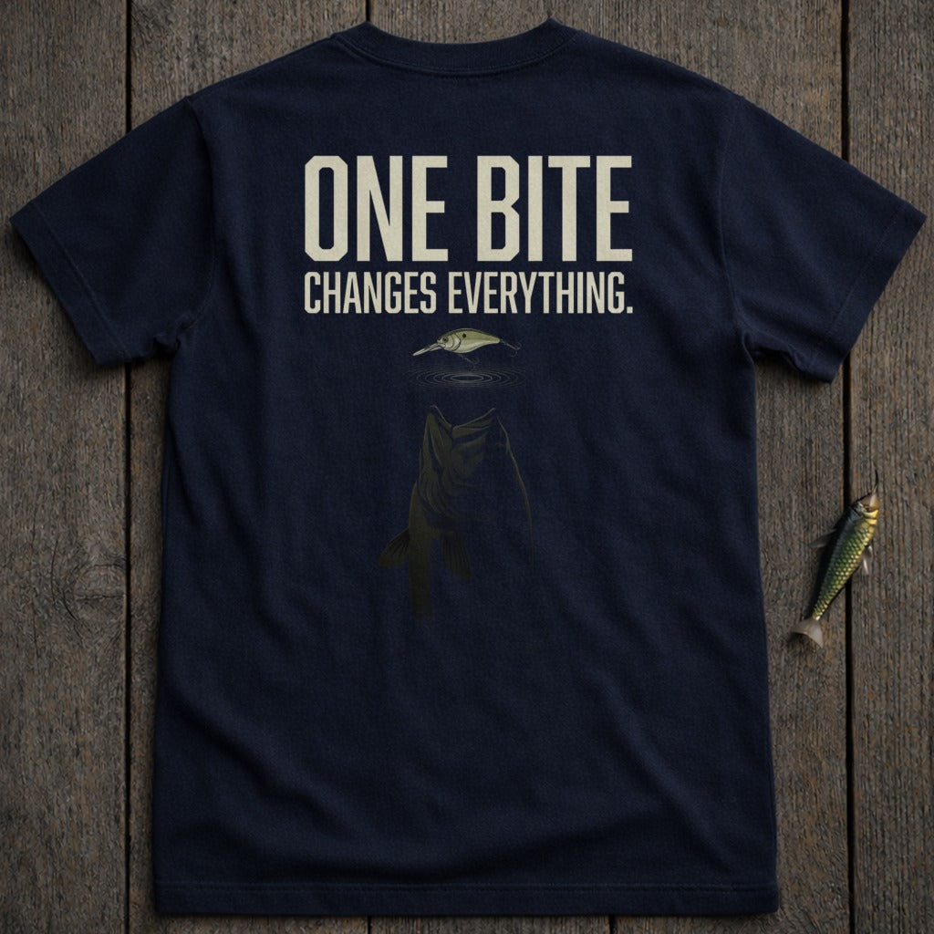Navy t-shirt with "ONE BITE CHANGES EVERYTHING." and a jumping fish graphic.