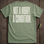 Green t-shirt with white text "NOT A HOBBY. A CONDITION."