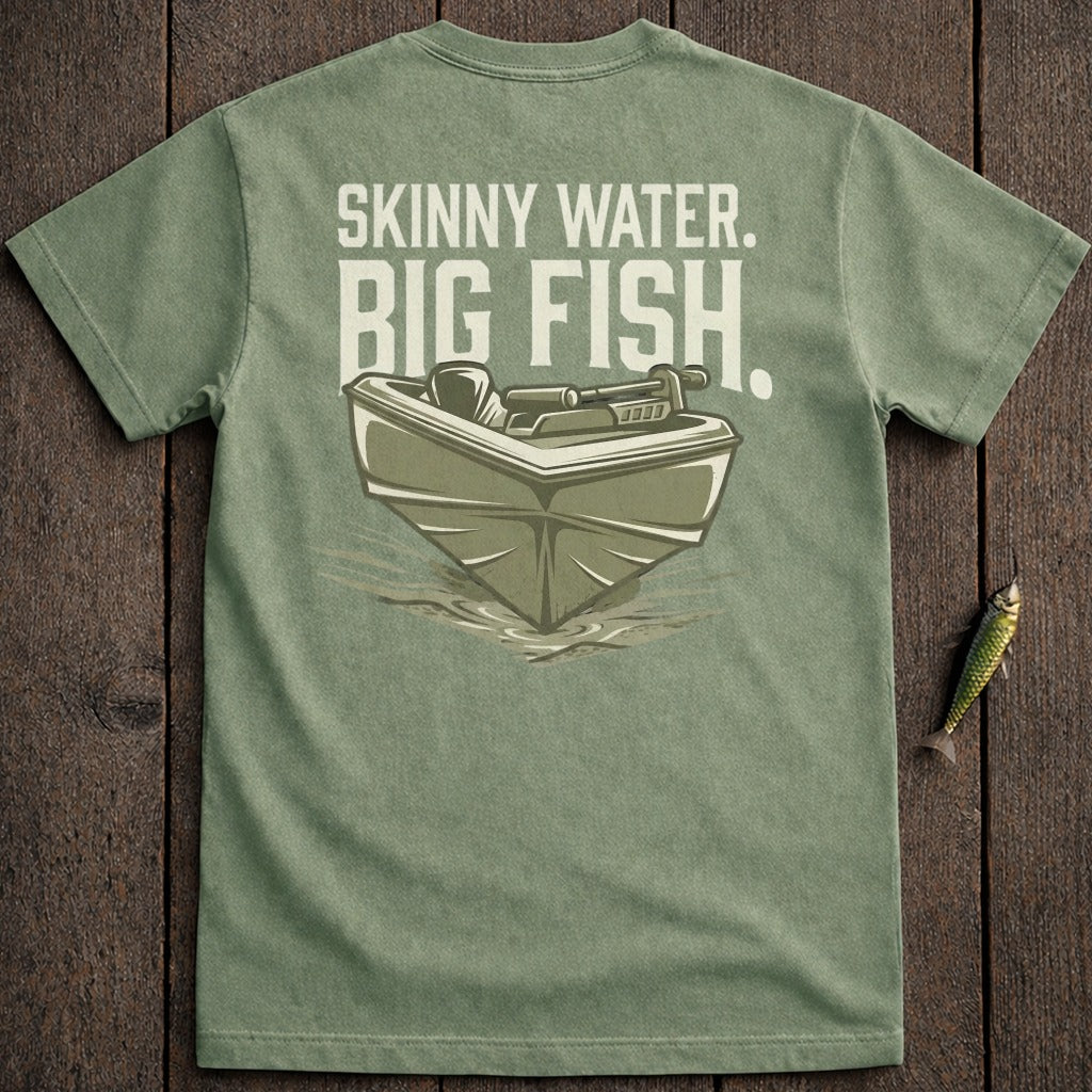 Green t-shirt with a graphic of a small boat on water, reading "Skinny Water. Big Fish."